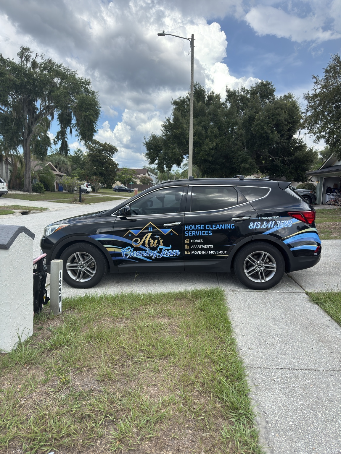 Ari's Cleaning Team vehicle in a Tampa Bay neighborhood